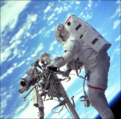 Astronaut Steven Smith floats above Earth