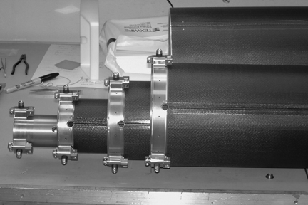 Image: Closeup of the top of the boom showing bolts and pegs holding the nestled tubes together.