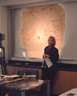 Janet Luhmann standing at the front of some classroom