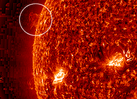 The dancing prominence (circled). It bounces up and down after getting hit by a faint but powerful solar tsunami